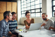 © Thurstan H/peopleimages.com - Making tomorrows success today. Shot of a group of coworkers having a meeting in an open plan office.