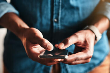 Aufkleber - My customers can text me too. Cropped shot of an unrecognizable businessman standing alone in his home office and texting on his cellphone.