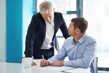 Poster - Collaborate with people you can learn from. Shot of two businesspeople having a discussion in a corporate office.