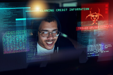 Aufkleber - Its time to attack. Shot of a young hacker cracking a computer code in the dark.