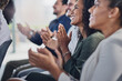 © AS/peopleimages.com - Acknowledging a colleagues achievement. Cropped shot of a group of businesspeople applauding during a seminar in the conference room.
