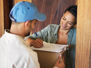 Poster - Ensuring your packages get delivered. Shot of a young woman standing at her front door signing for a package from a courier.