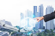 © wanniwat - Robot hands exchanging brains with humans on a background lined with skyscrapers, AI(Artificial Intelligence) concept, Science and artificial intelligence technology, innovation and futuristic.