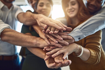 Aufkleber - Success belongs to those who grab it. Shot of a group of colleagues joining their hands in solidarity at work.