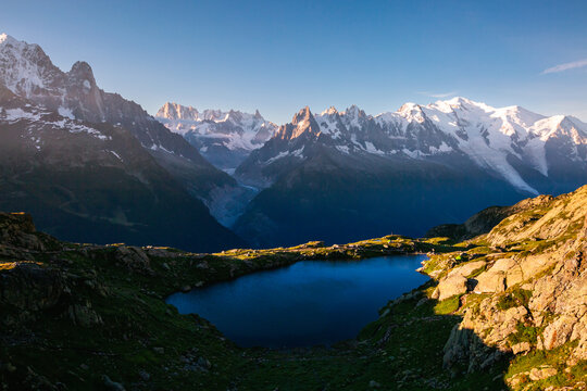 Wall Mural - Perfect morning scene of high alpine lake Lac Blanc and Mont Blanc glacier. Graian Alps, France, Europe.