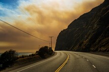 Empty Road Beneath Smoke From Fire