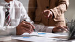 © qOppi - Team of business meeting with analyze chart paper.