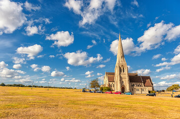 Wall Mural - Blackheath with All Saints. Greenwich park with Cloudy Blue Sky and Green Grass. London, England. United Kingdom