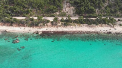 Wall Mural - Aerial view of beautiful empty beach in Greece, no people. Dramatic coastline scenic bay rocky cliffs in the Ionian island, Port Katsiki, Lefkada. Blue turquoise waving sea.