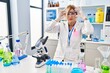 © Krakenimages.com - Middle age blonde woman working at scientist laboratory trying to open eyes with fingers, sleepy and tired for morning fatigue
