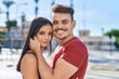 © Krakenimages.com - Man and woman couple smiling confident hugging each other at street