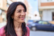 © Krakenimages.com - Middle age hispanic woman smiling confident looking to the side at street