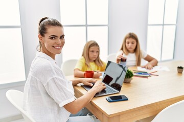 Wall Mural - Mother and daughters smiling confident working and drawing at office