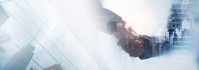Business success and investment, teamwork and partnership concept. Partnership business handshake for sucessful investment and deal, marketing plan
