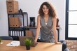 © Krakenimages.com - Young beautiful hispanic woman business worker smiling confident standing at office
