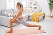 © Krakenimages.com - Young blonde woman training yoga exercise at home