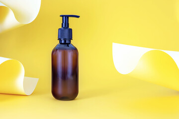 Wall Mural - Mockup  of a cosmetic pump bottle on an abstract background with colored paper