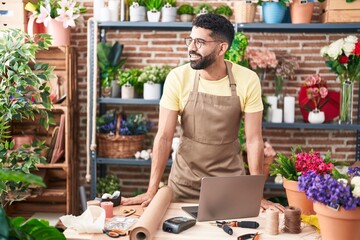 Sticker - Young arab man florist smiling confident standing at florist