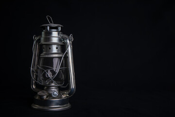 old oil lamp on black background