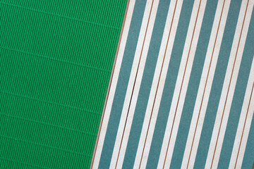 Poster - green corrugated paper and cut scrapbook paper stripes with pattern