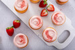 Strawberry lemonade cupcakes with a swirl of cream cheese frosting