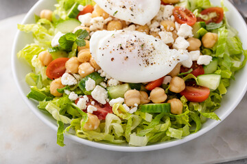 Wall Mural - Fresh vegetable salad with chickpeas and feta