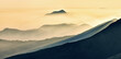 Mountain silhouettes in the fog. Graphic landscape on the theme of mountains