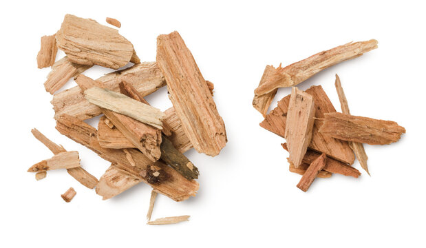 closeup of two piles of cedar or palo santo incense, wood chips isolated over a transparent backgrou