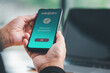 © Mdisk - Businessman hand holds a smartphone on screen with message payment successful Concept. business, banking, financial online transactions with mobile devices. money sent transfer, shopping online, cyber