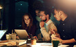 © A.B./peopleimages.com - Business, late night and team with laptop, fast food and planning ideas at workshop at startup project. Teamwork, overtime and diversity, dinner for men and women brainstorming at creative agency.