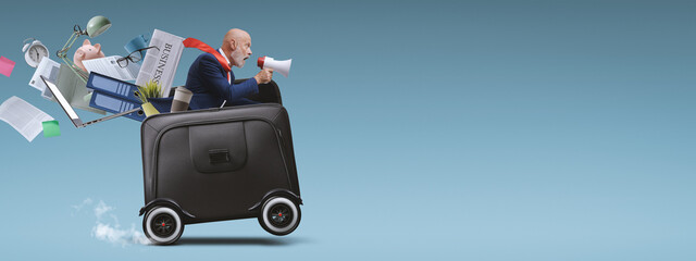 Wall Mural - Businessman with megaphone riding a briefcase with wheels