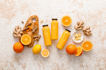 Sticker - Smoothie. Healthy fresh raw detox citrus smoothie with orange, lemon, ginger and turmeric in a glass bottles on a table. Healthy diet vegan food full of antioxidants