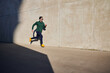 © baranq - Man running on the street on sunny afternoon wearing sunglasses and sports clothes