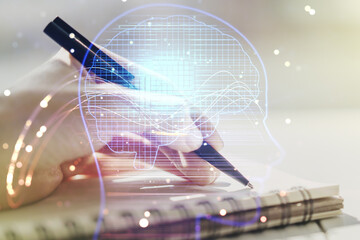 Poster - Double exposure of creative human head microcircuit with man hand writing in notepad on background. Future technology and AI concept