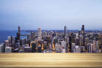 Wall Mural - Blank wooden table top with beautiful Chicago skyline at evening on background, mockup