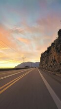 POV car driving, coastline road trip, sunset, vertical short video, wallpaper