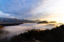 Lake Bled In Fog With A Rising Sun