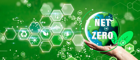 Wall Mural - zero emissions and carbon neutral concept in the hand. renewable energy by 2050 carbon neutral energ