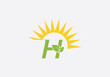 © Nasir Stock Photo - Green leaf  solar logo design and eco sun icon letter H