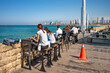 Coffee shop at Old Jaffa embankment over Mediterranean sea and Tel Aviv skyline. Israel.