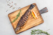 Grilled mackerel on a cutting board