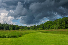 A Field And Stormy Sky Nature Landscape