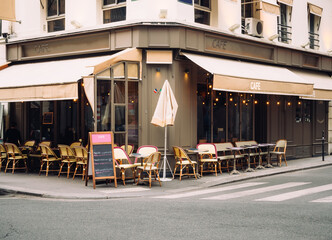 Wall Mural - cozy street with tables of cafe in paris, france. architecture and landmark of paris. cozy paris cit