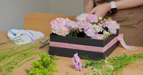 Sticker - Female florist make a gift box of flower