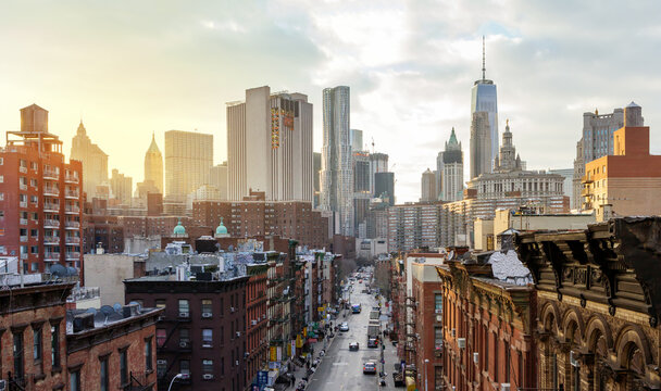 overhead view of madison street in the chinatown neighborhood of manhattan with the downtown skyline