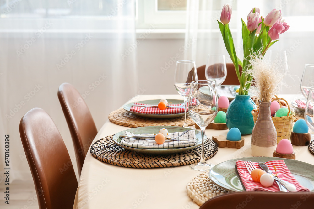 Festive table served for Easter celebration near window
