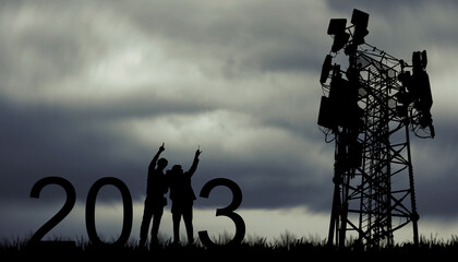 Silhouette team electricians, architects working in the rainy season overcast sky two engineers plan 2023 towering outdoor telecom antennas that will improve the efficiency of 5G technology.