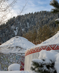 snow covered yurt and trees