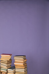 many books stacked on a purple background in the library of science knowledge