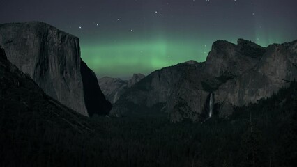 Wall Mural - Northern Lights (Aurora Borealis) are shining over Yosemite National Park. Time Lapse. 